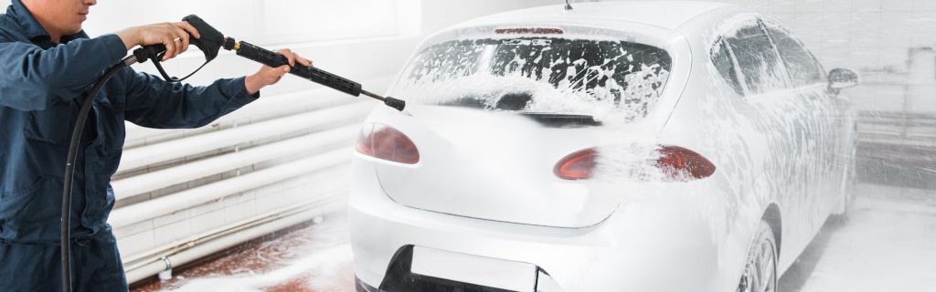 car-wash-employee-cleaning-dirt-pressure-water-foam.jpg